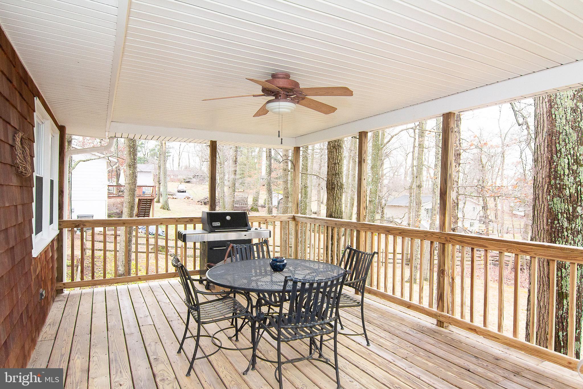 4813 Millers Station Road Hampstead, MD 21074 - Photo 27 of 32 a view of a dining room with furniture window and wooden floor