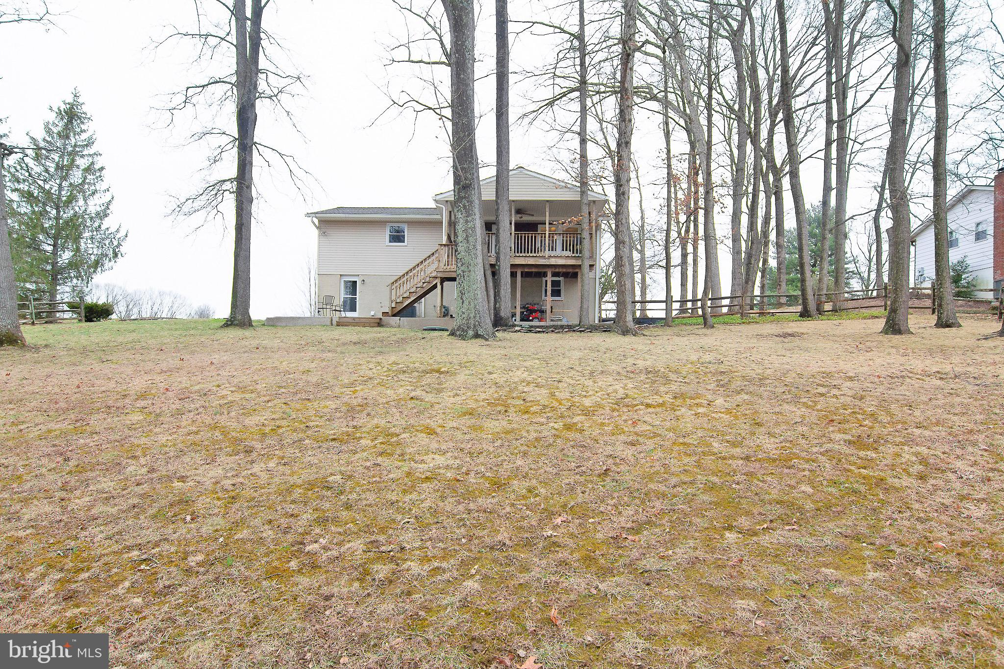 4813 Millers Station Road Hampstead, MD 21074 - Photo 3 of 32 a big house with trees in front of it