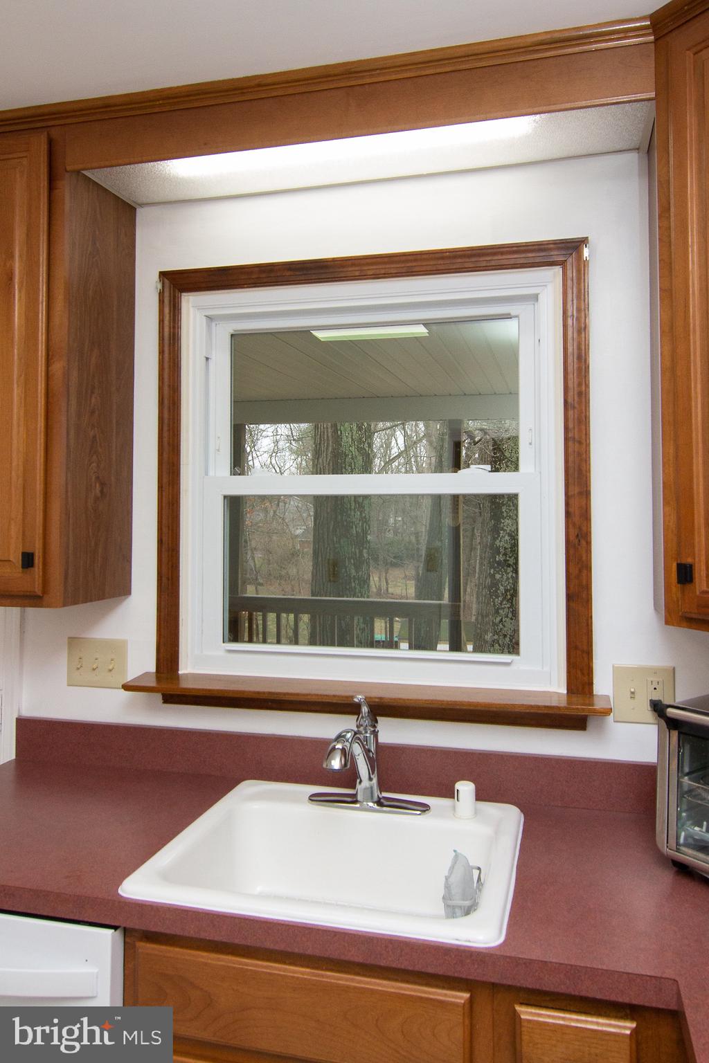 4813 Millers Station Road Hampstead, MD 21074 - Photo 9 of 32 a bathroom with a sink and a mirror