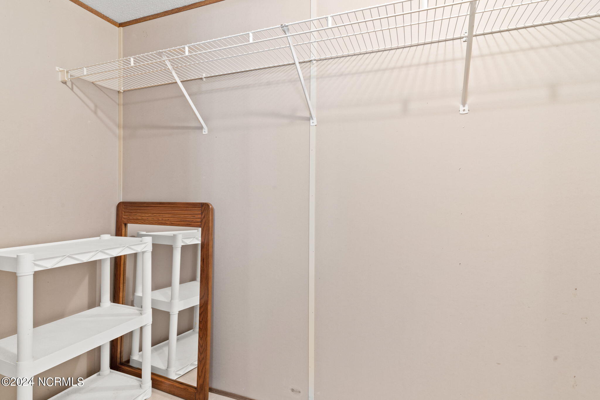 6323 Partridge Road Southwest Ocean Isle Beach, NC 28469 - Photo 17 of 45 Master Closet 1