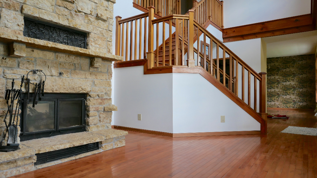2346 West Longhollow Road Elizabeth, IL 61028 - Photo 19 of 44 a view of an entryway with wooden floor and a fireplace
