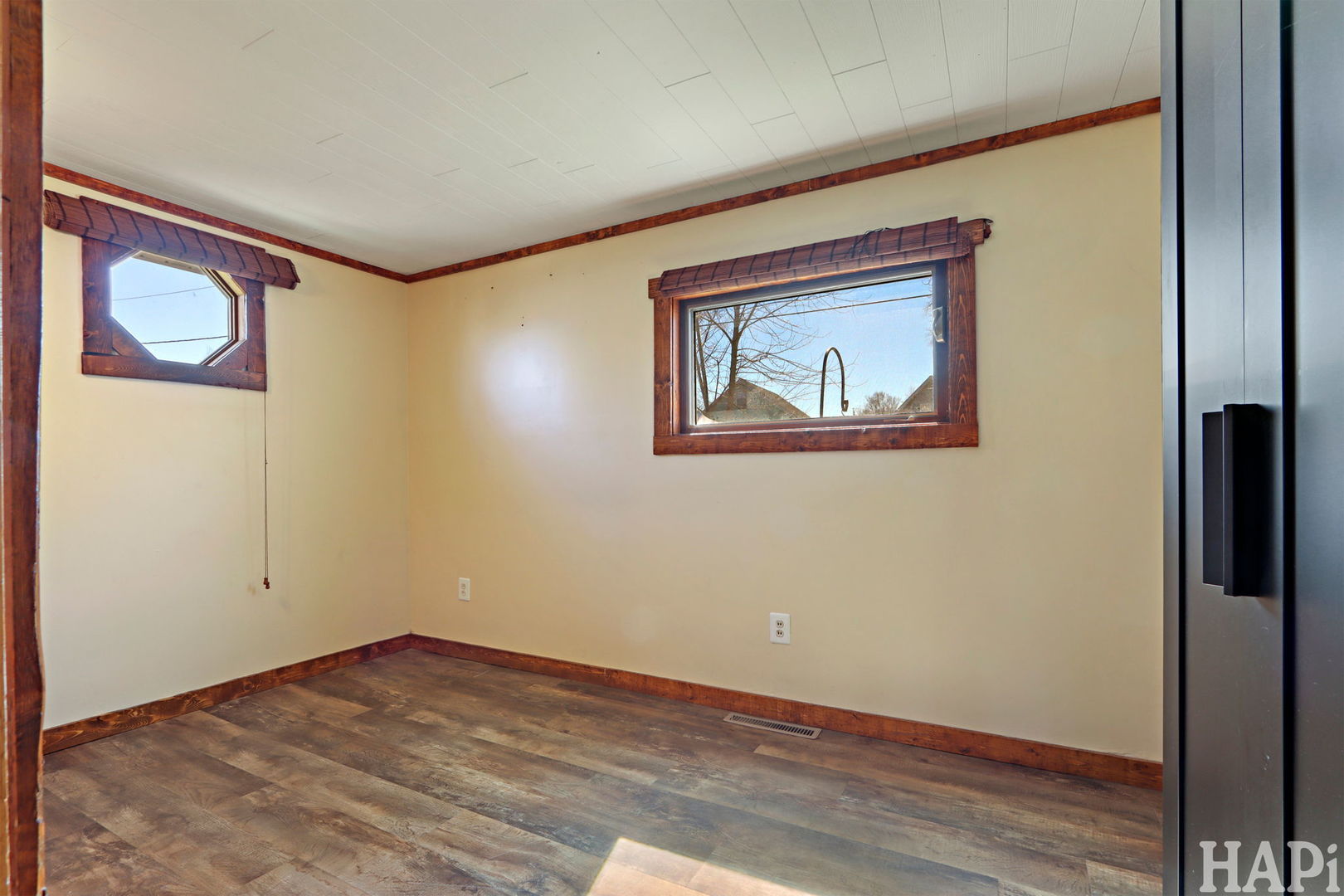 1319 Nippersink Drive Spring Grove, IL 60081 - Photo 14 of 27 a view of an empty room with wooden floor and a window
