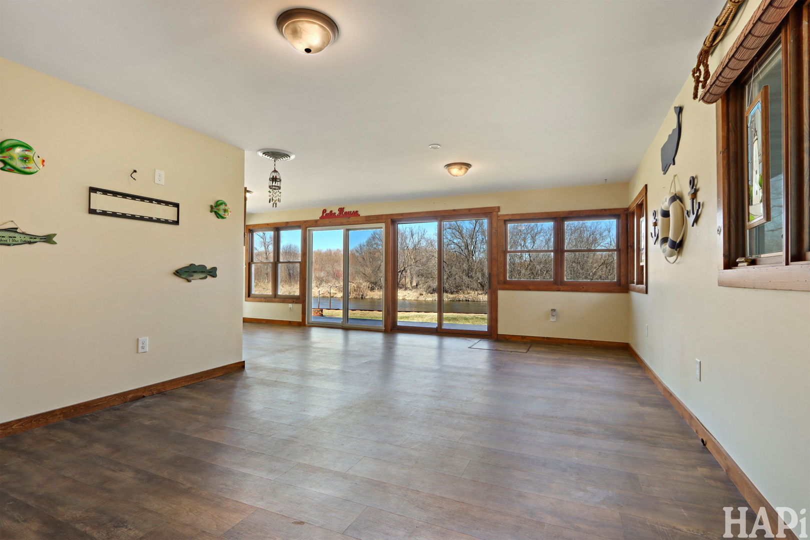 1319 Nippersink Drive Spring Grove, IL 60081 - Photo 8 of 27 a view of an empty room with wooden floor and a window