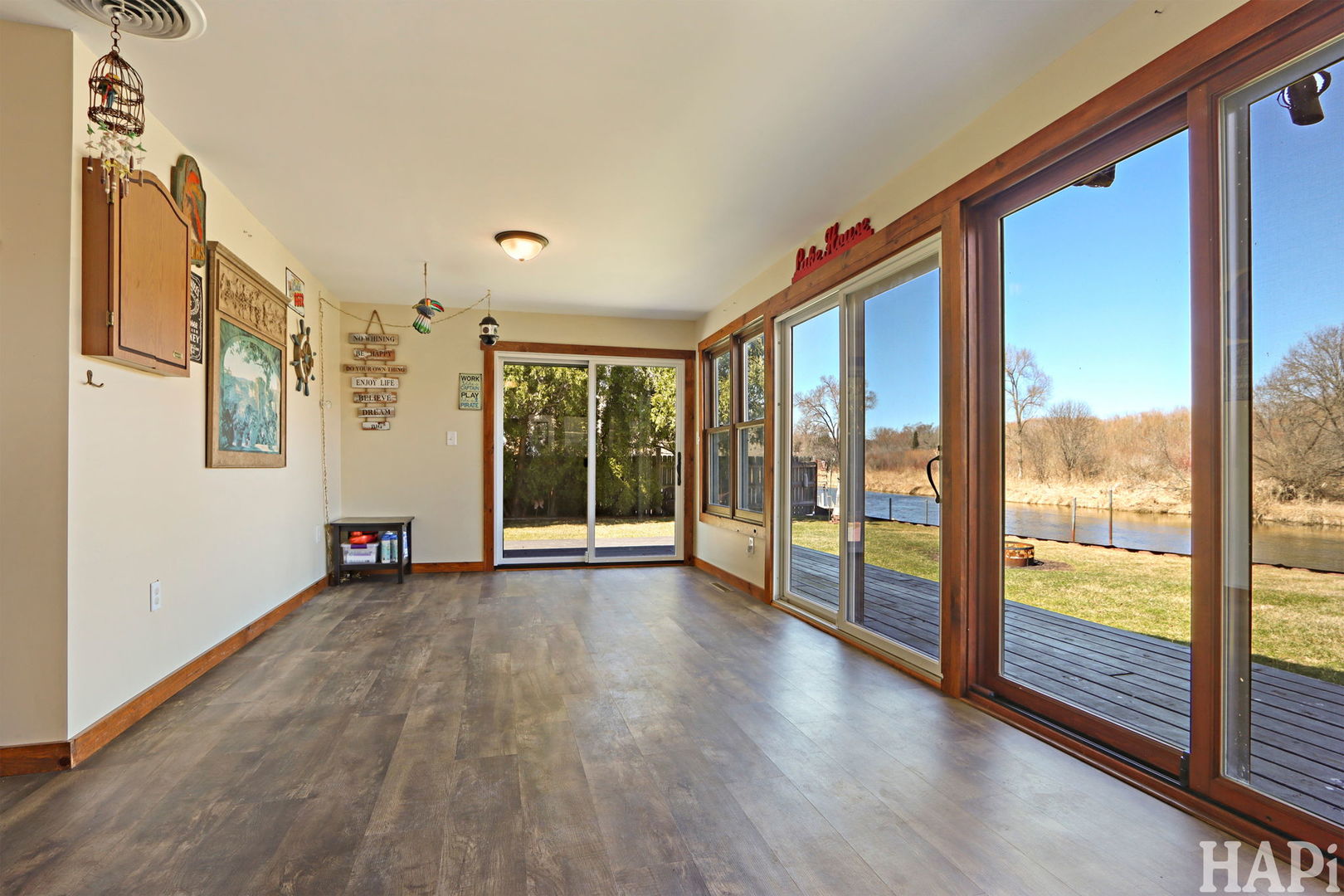 1319 Nippersink Drive Spring Grove, IL 60081 - Photo 9 of 27 a view of an empty room with wooden floor and a window