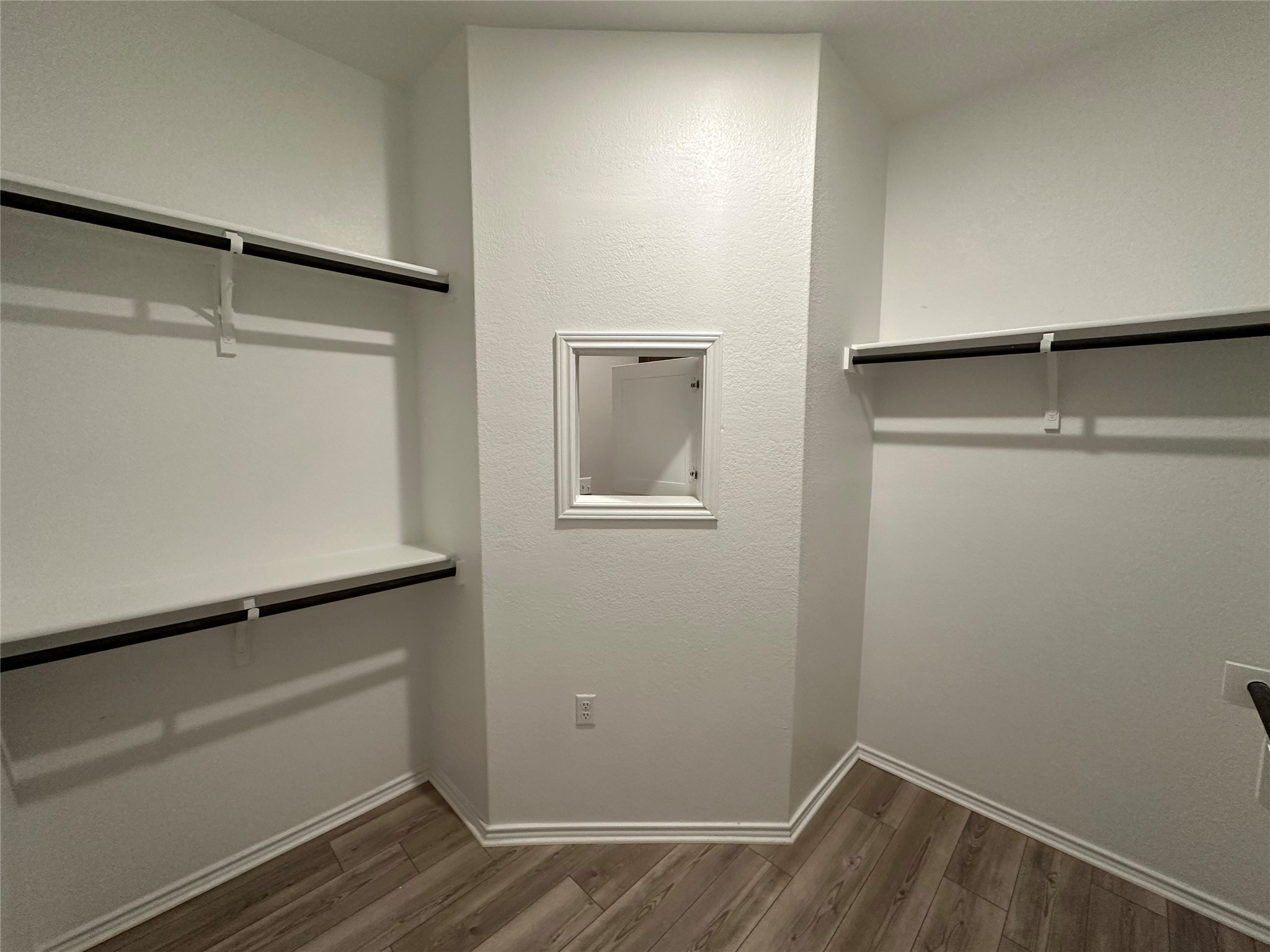 219 Coachsmith Street Georgetown, TX 78633 - Photo 14 of 25 Walk in closet with dark wood-style floors