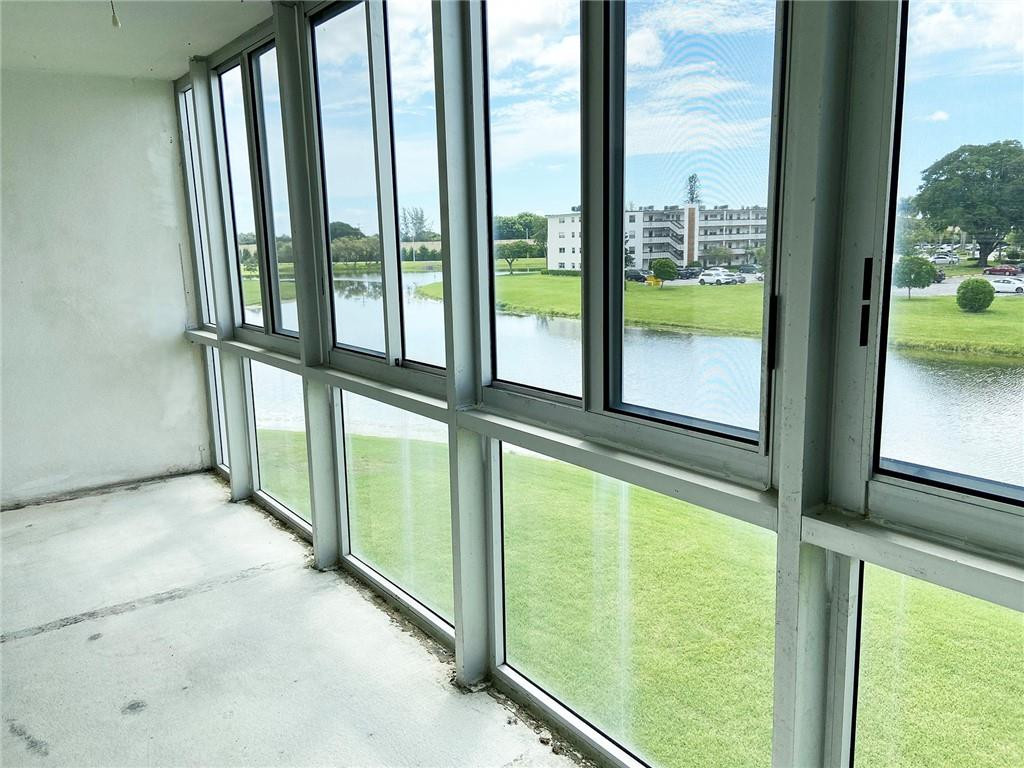 3035 Guildford East, Unit 3035 Boca Raton, FL 33434 - Photo 14 of 21 Rear patio w/impact windows