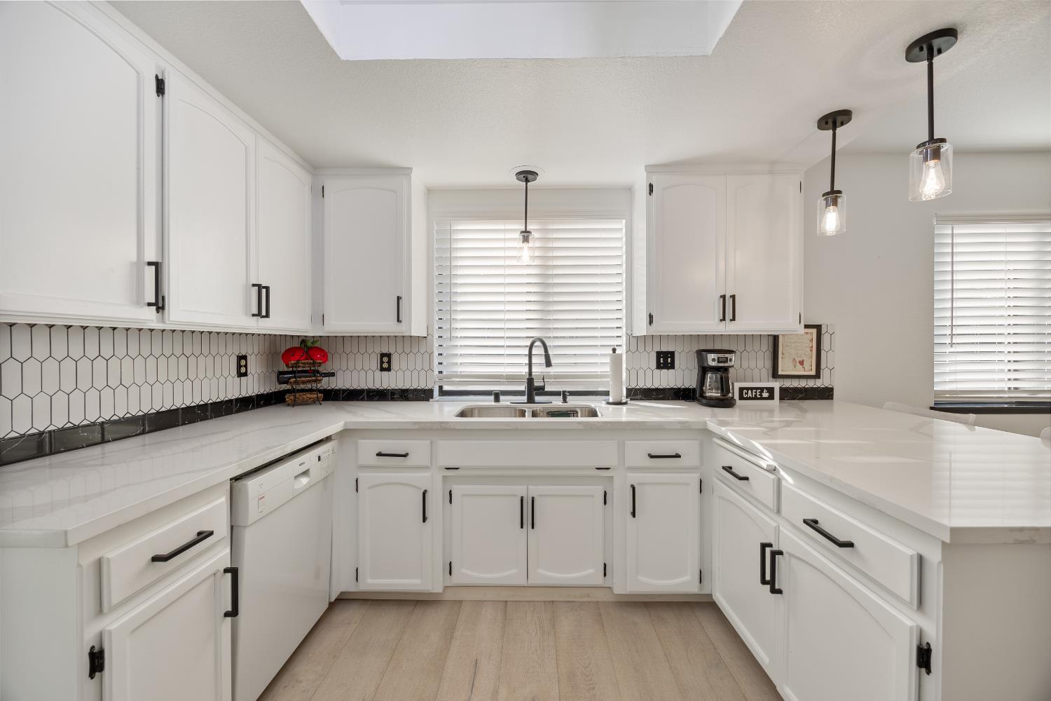 3980 Rustic Road Cameron Park, CA 95682 - Photo 11 of 42 a kitchen with white cabinets and white appliances