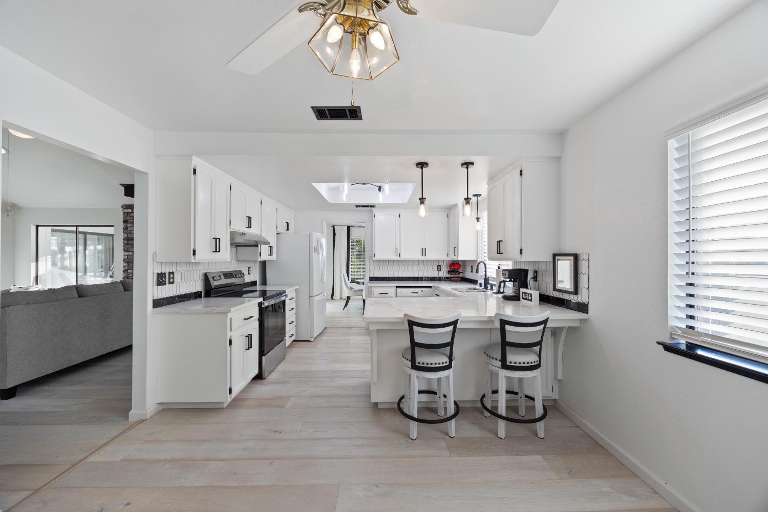 3980 Rustic Road Cameron Park, CA 95682 - Photo 13 of 42 a kitchen with lots of counter space and appliances