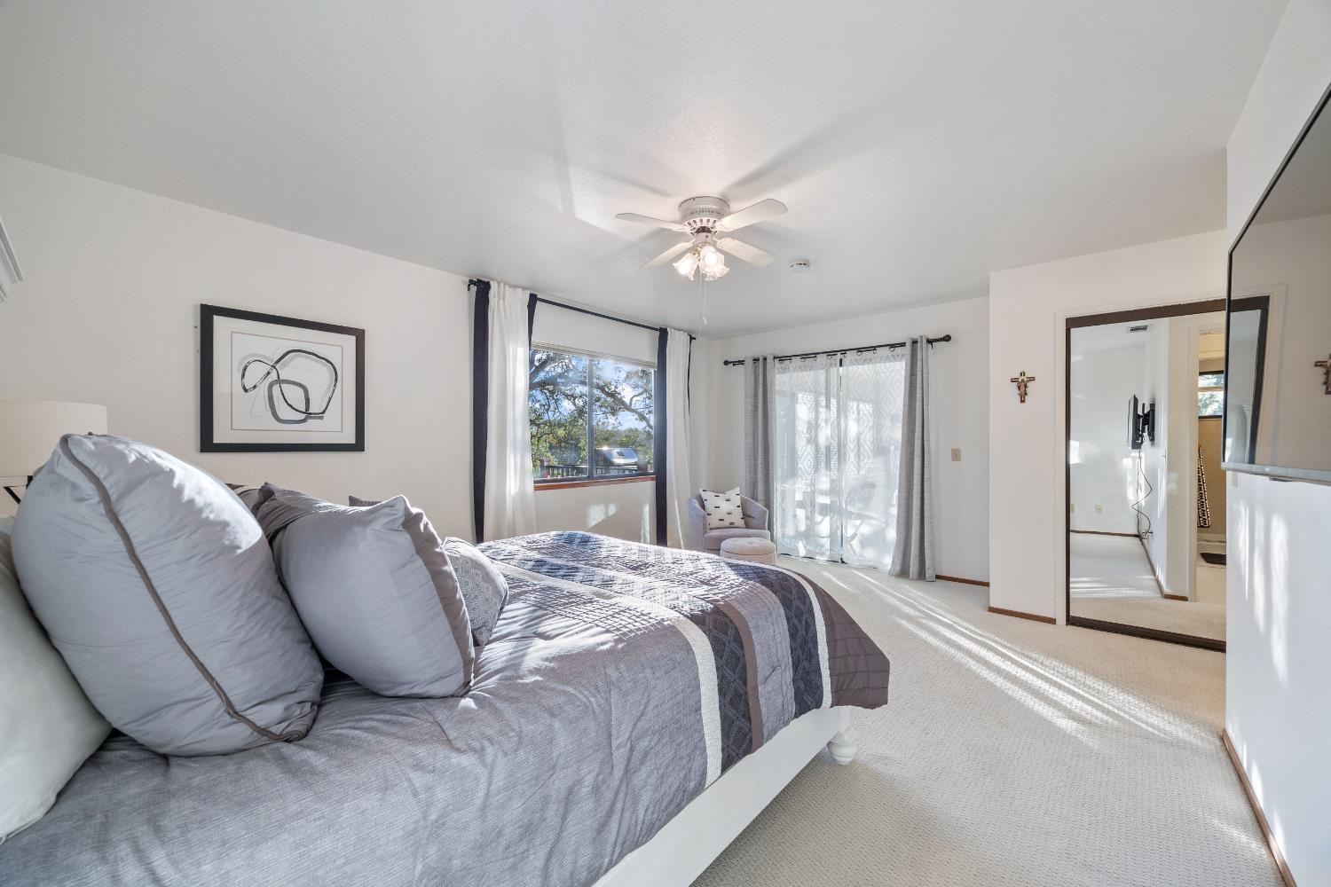 3980 Rustic Road Cameron Park, CA 95682 - Photo 18 of 42 a bed sitting in a spacious bedroom next to a window