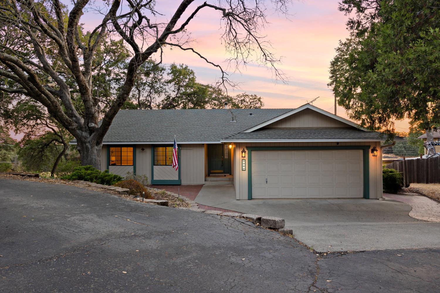 3980 Rustic Road Cameron Park, CA 95682 - Photo 2 of 42 a front view of house with garage and yard