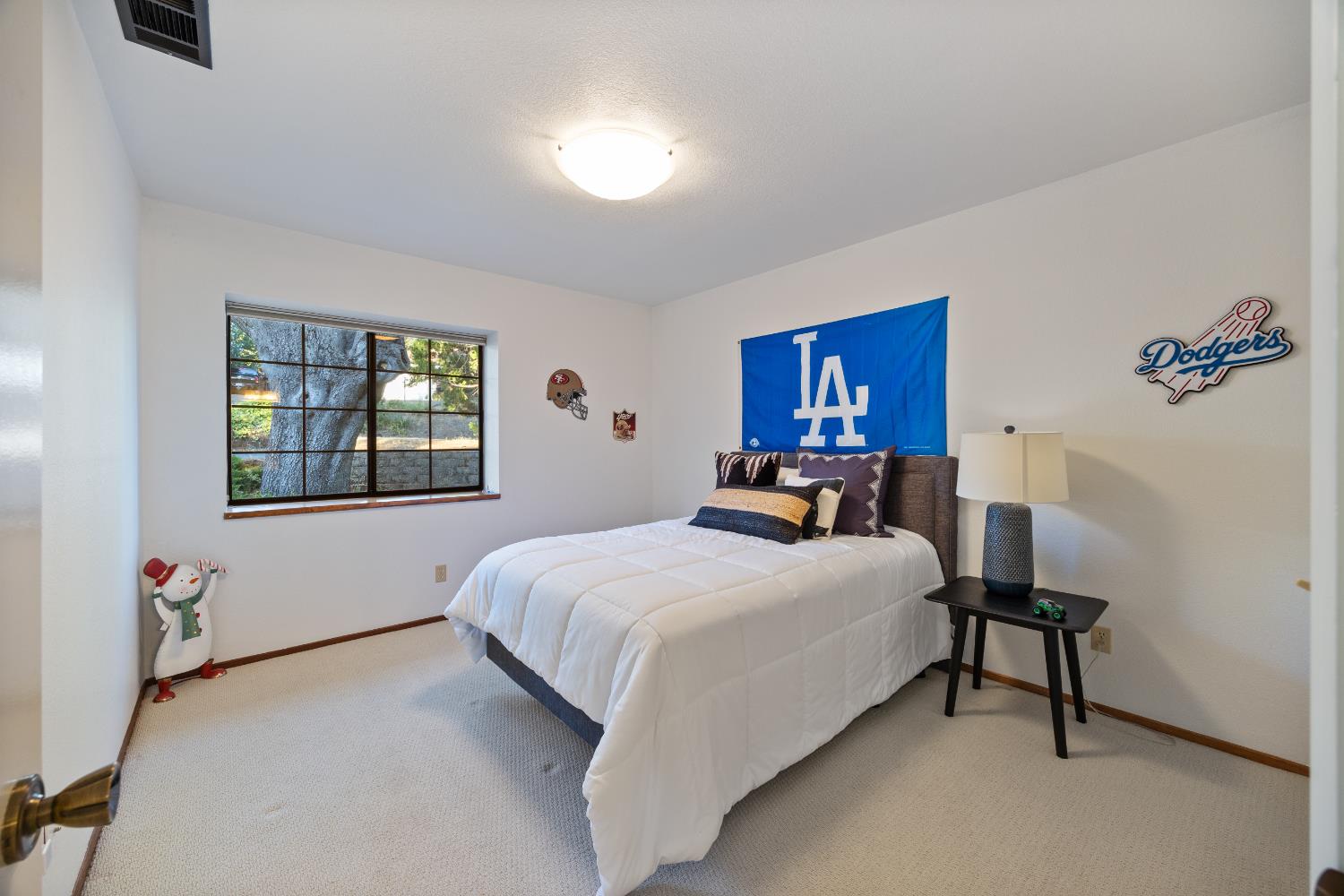 3980 Rustic Road Cameron Park, CA 95682 - Photo 21 of 42 a bedroom with a bed wall painting and a window