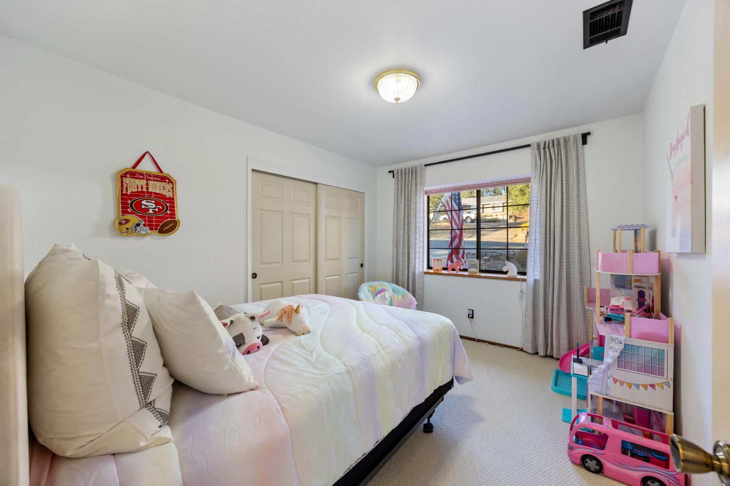 3980 Rustic Road Cameron Park, CA 95682 - Photo 22 of 42 a bed room with a bed and a couch