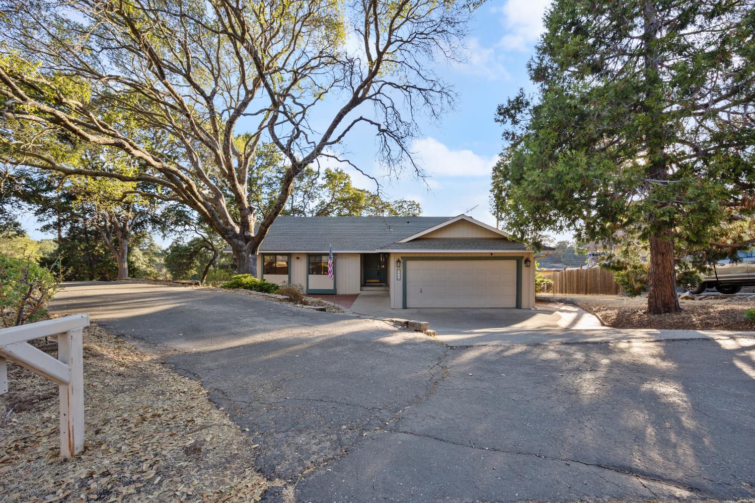 3980 Rustic Road Cameron Park, CA 95682 - Photo 31 of 42 a view of a house with a yard covered in snow