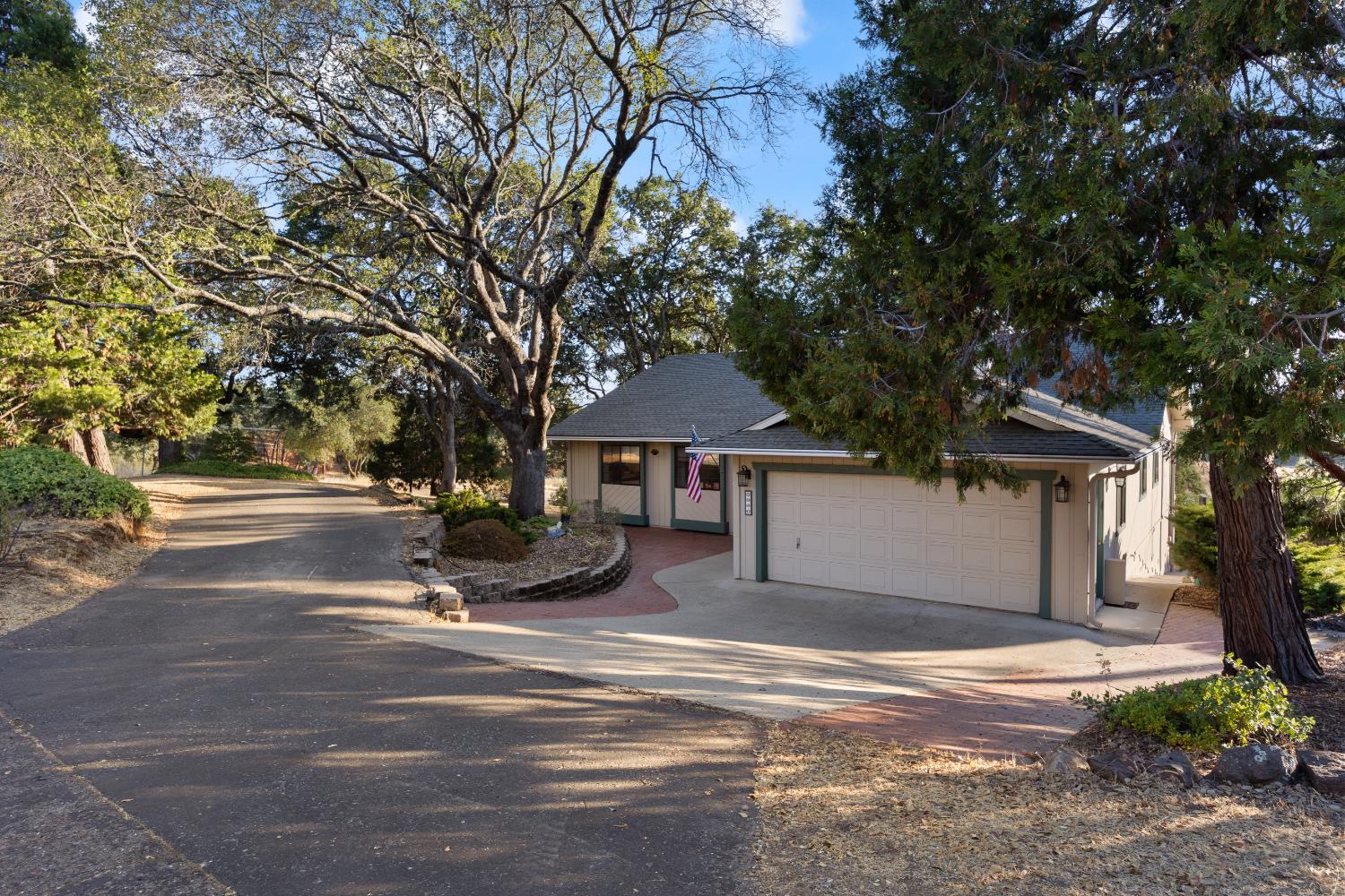 3980 Rustic Road Cameron Park, CA 95682 - Photo 32 of 42 a view of a house with a outdoor space