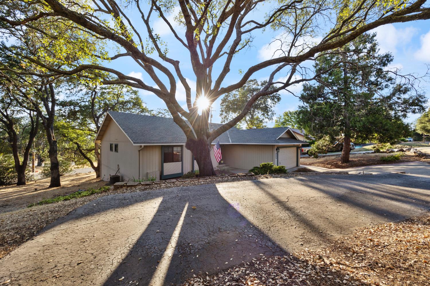 3980 Rustic Road Cameron Park, CA 95682 - Photo 35 of 42 a view of a house with a yard covered in snow