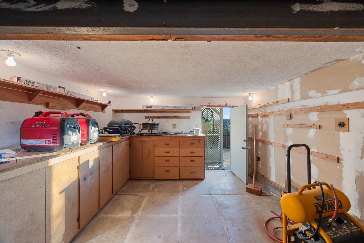 3980 Rustic Road Cameron Park, CA 95682 - Photo 40 of 42 a kitchen with refrigerator and cabinets