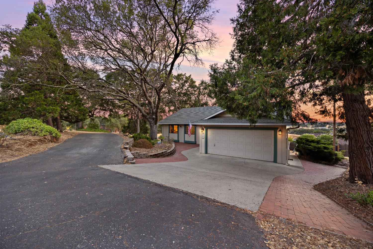 3980 Rustic Road Cameron Park, CA 95682 - Photo 5 of 42 a view of a patio with table and chairs under an umbrella
