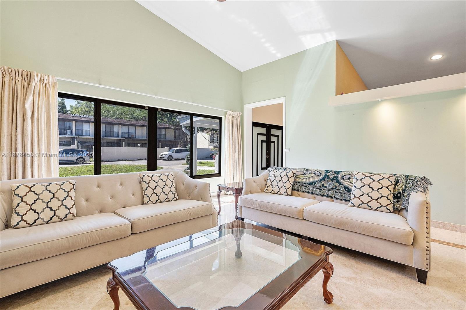 2531 Northeast 195th Street Aventura, FL 33180 - Photo 14 of 45 a living room with furniture and a large window