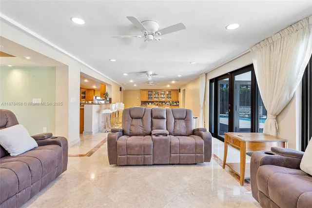 a kitchen with stainless steel appliances granite countertop a sink and cabinets