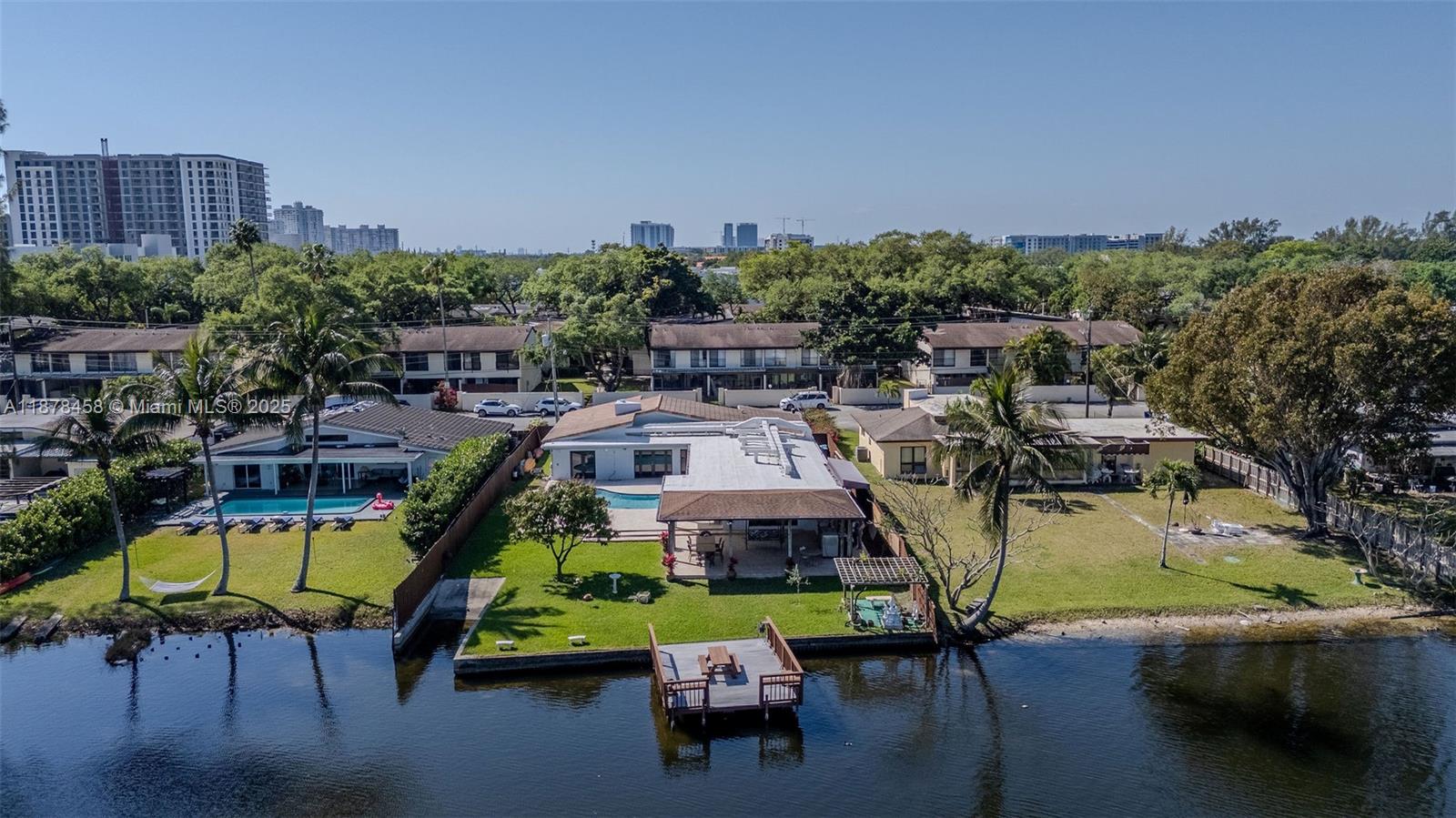 2531 Northeast 195th Street Aventura, FL 33180 - Photo 2 of 45 an aerial view of a house with a swimming pool patio and outdoor seating