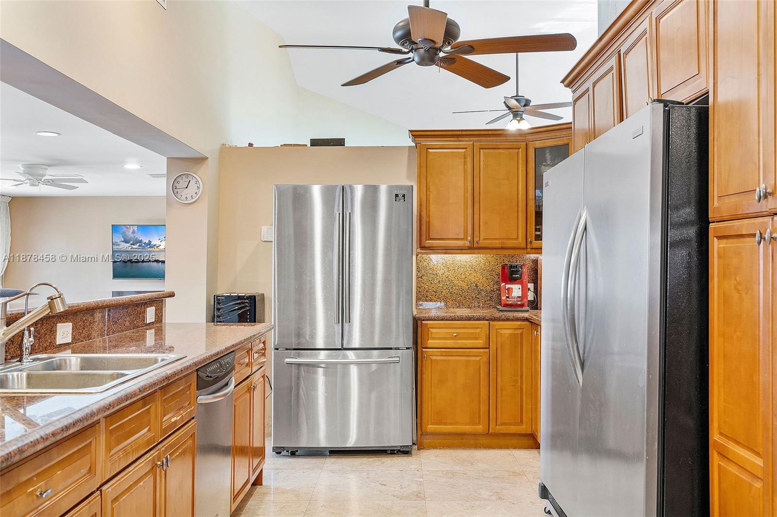 2531 Northeast 195th Street Aventura, FL 33180 - Photo 25 of 45 a kitchen with stainless steel appliances granite countertop a refrigerator and a sink