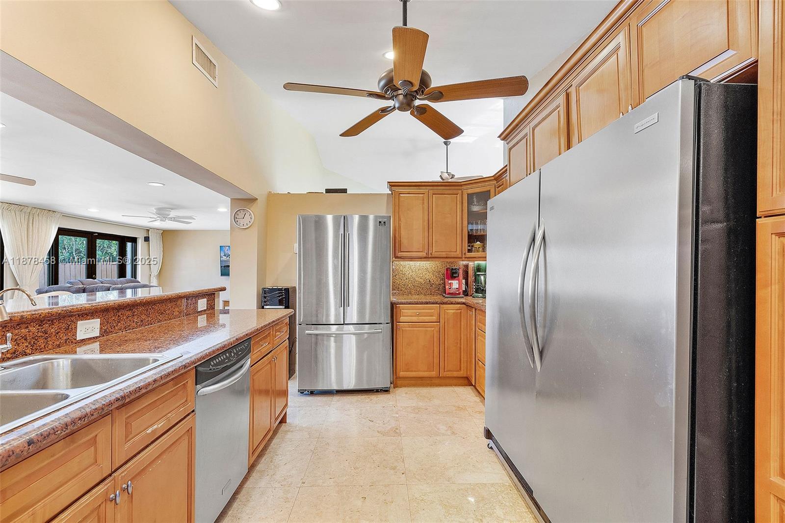 2531 Northeast 195th Street Aventura, FL 33180 - Photo 26 of 45 a kitchen with refrigerator cabinets and a sink