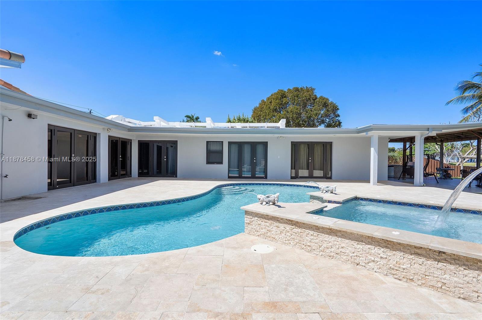 2531 Northeast 195th Street Aventura, FL 33180 - Photo 31 of 45 front view of a house with a yard