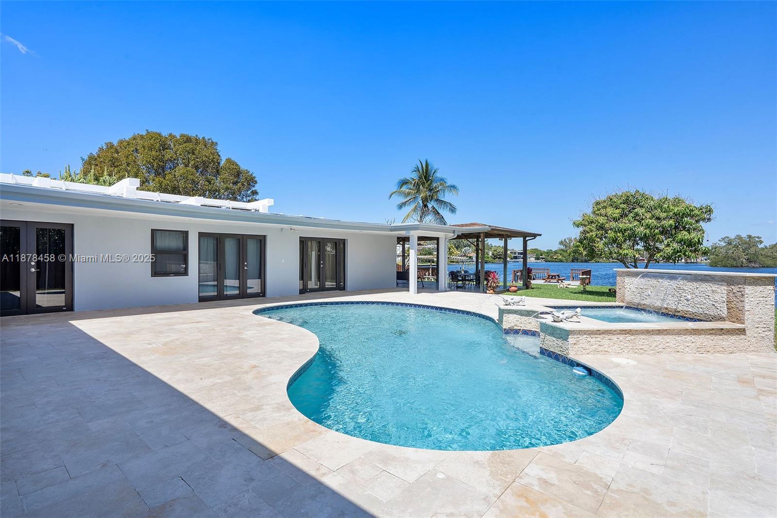 2531 Northeast 195th Street Aventura, FL 33180 - Photo 34 of 45 a view of a house with swimming pool and a yard