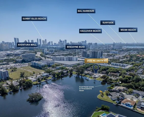 a view of a hallway with wooden floor and entryway