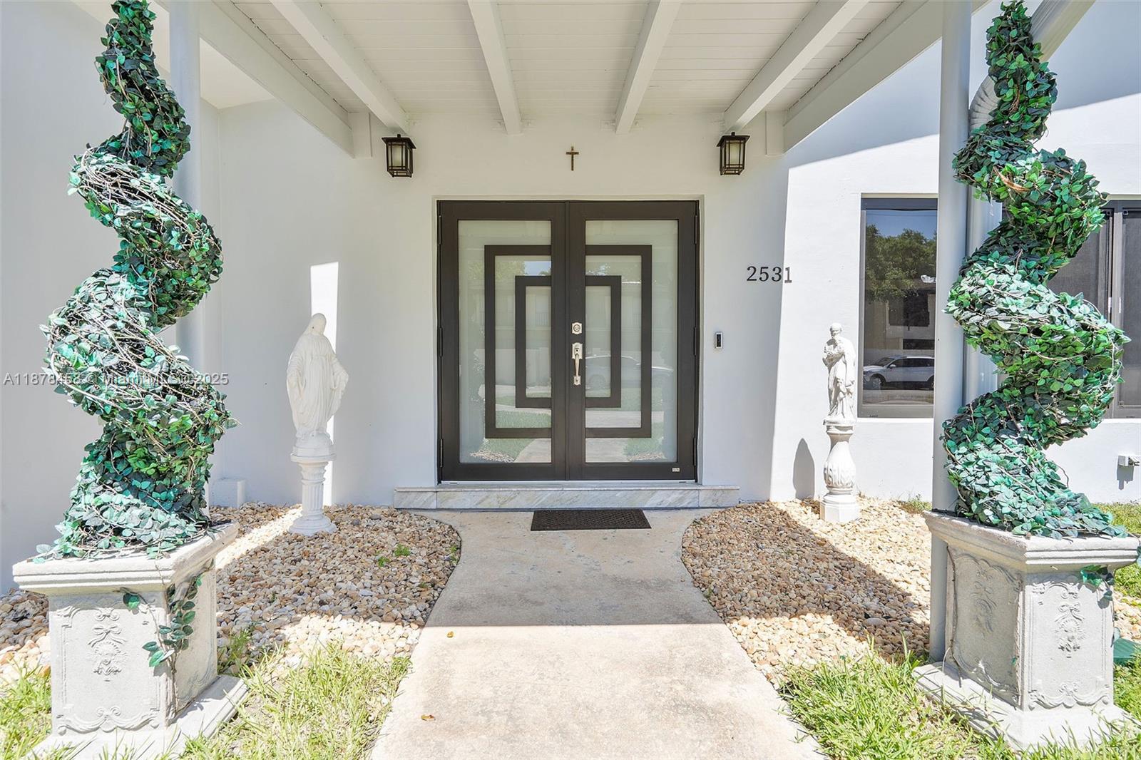 2531 Northeast 195th Street Aventura, FL 33180 - Photo 9 of 45 a front view of a house