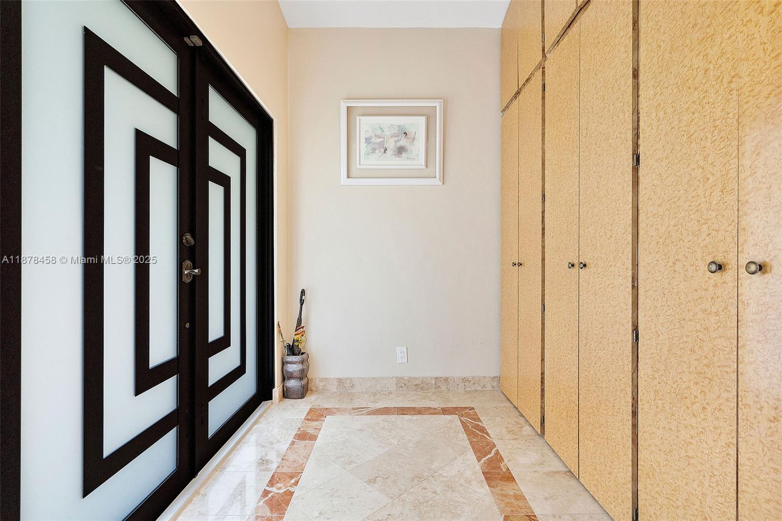 2531 Northeast 195th Street Aventura, FL 33180 - Photo 10 of 45 a view of a hallway with wooden floor and entryway