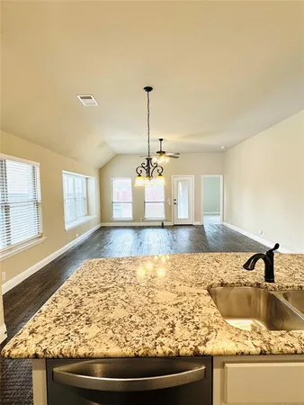 a kitchen with sink and window