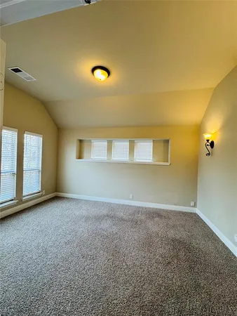 an empty room with a empty space and windows