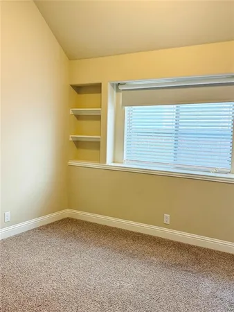 a view of a room that has a window
