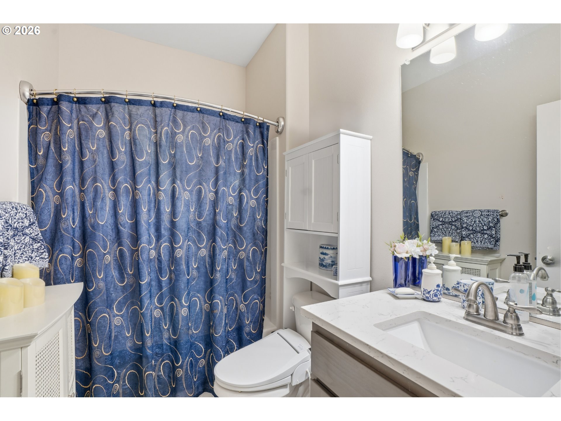 17314 Northeast 17th Avenue Ridgefield, WA 98642 - Photo 18 of 25 a bathroom with a sink vanity mirror and toilet