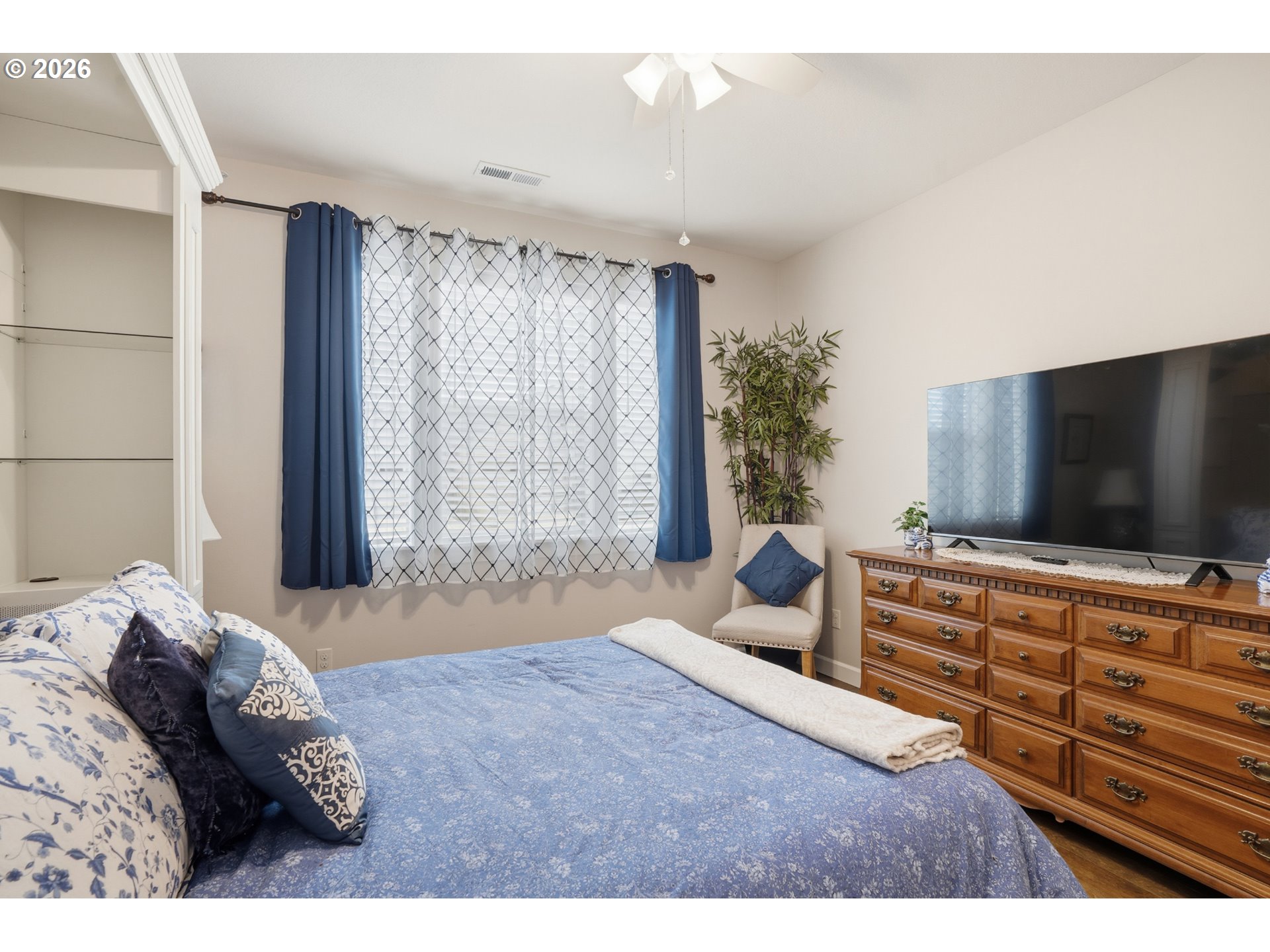 17314 Northeast 17th Avenue Ridgefield, WA 98642 - Photo 22 of 25 a bedroom with a bed and a flat screen tv