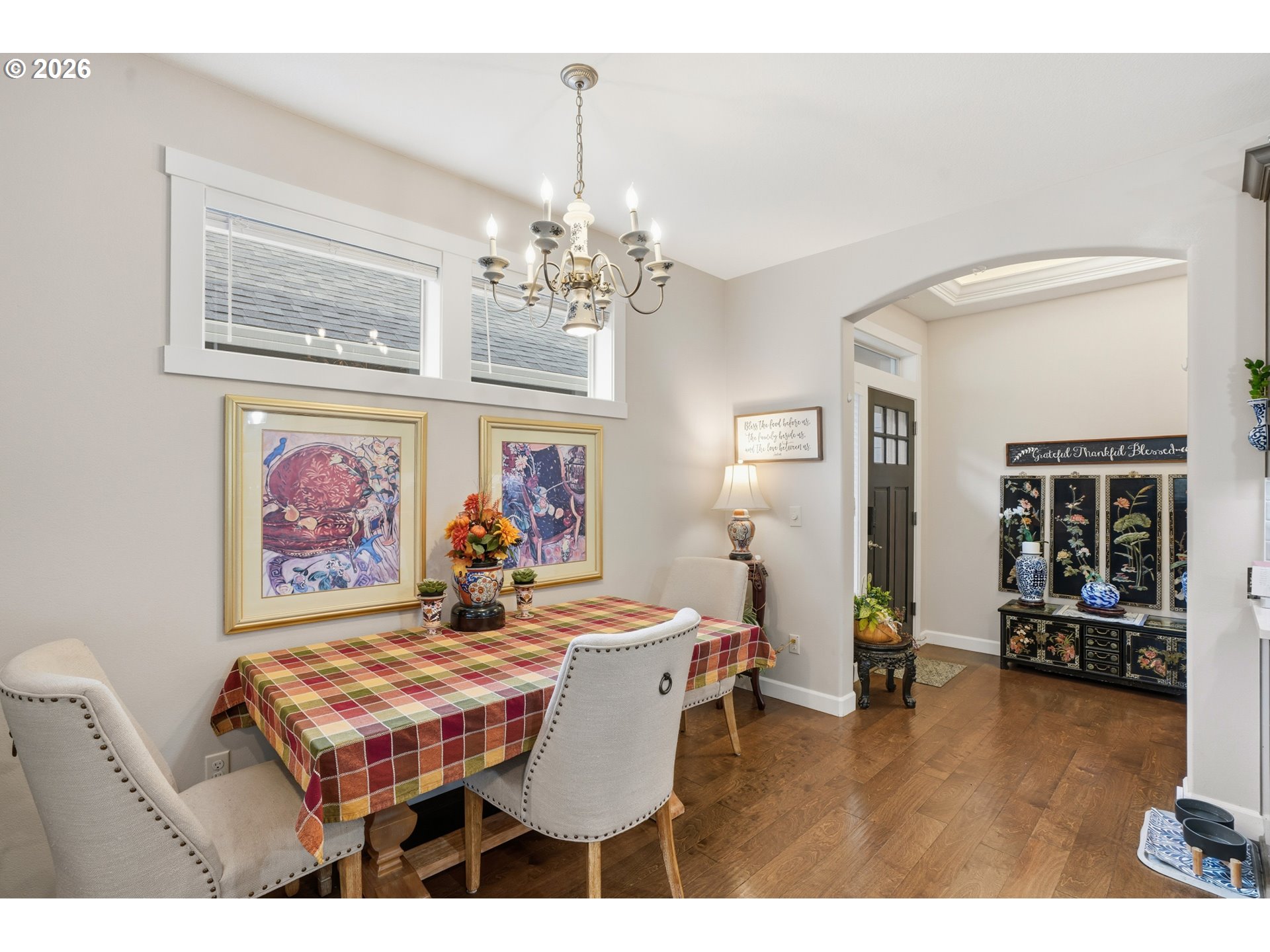 17314 Northeast 17th Avenue Ridgefield, WA 98642 - Photo 5 of 25 a dining room with chandelier and wooden floor