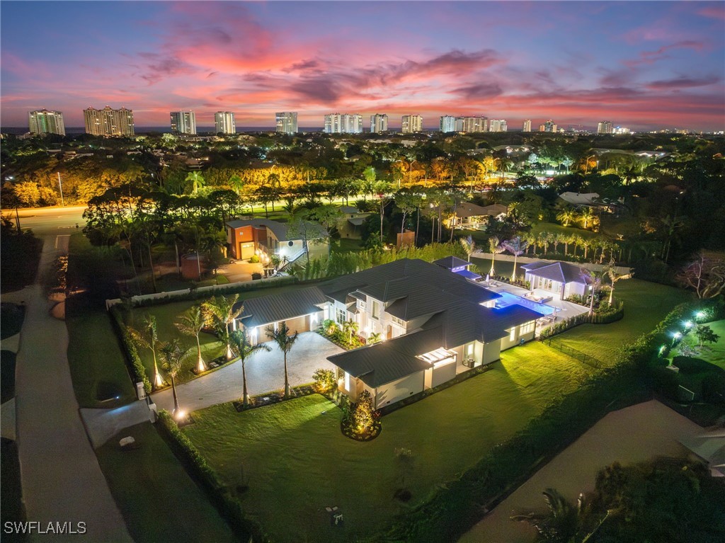39 Cajeput Drive Naples, FL 34108 - Photo 1 of 50 a view of a lake in middle of the city