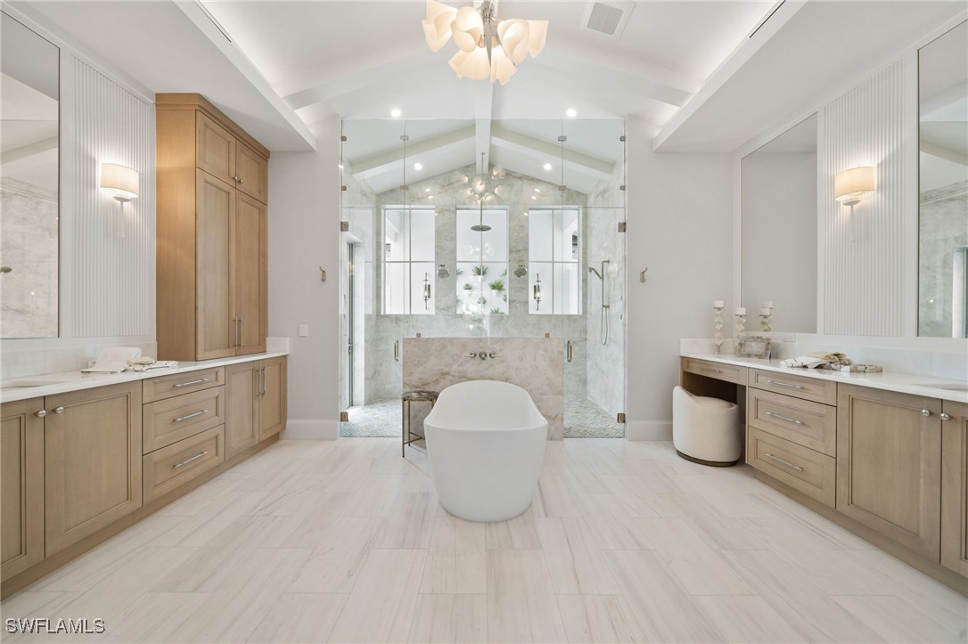 39 Cajeput Drive Naples, FL 34108 - Photo 22 of 50 a large white kitchen with a large window