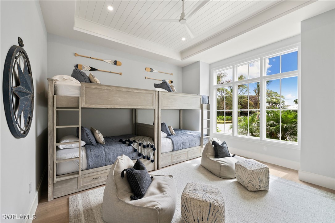 39 Cajeput Drive Naples, FL 34108 - Photo 27 of 50 a bedroom with furniture and a window