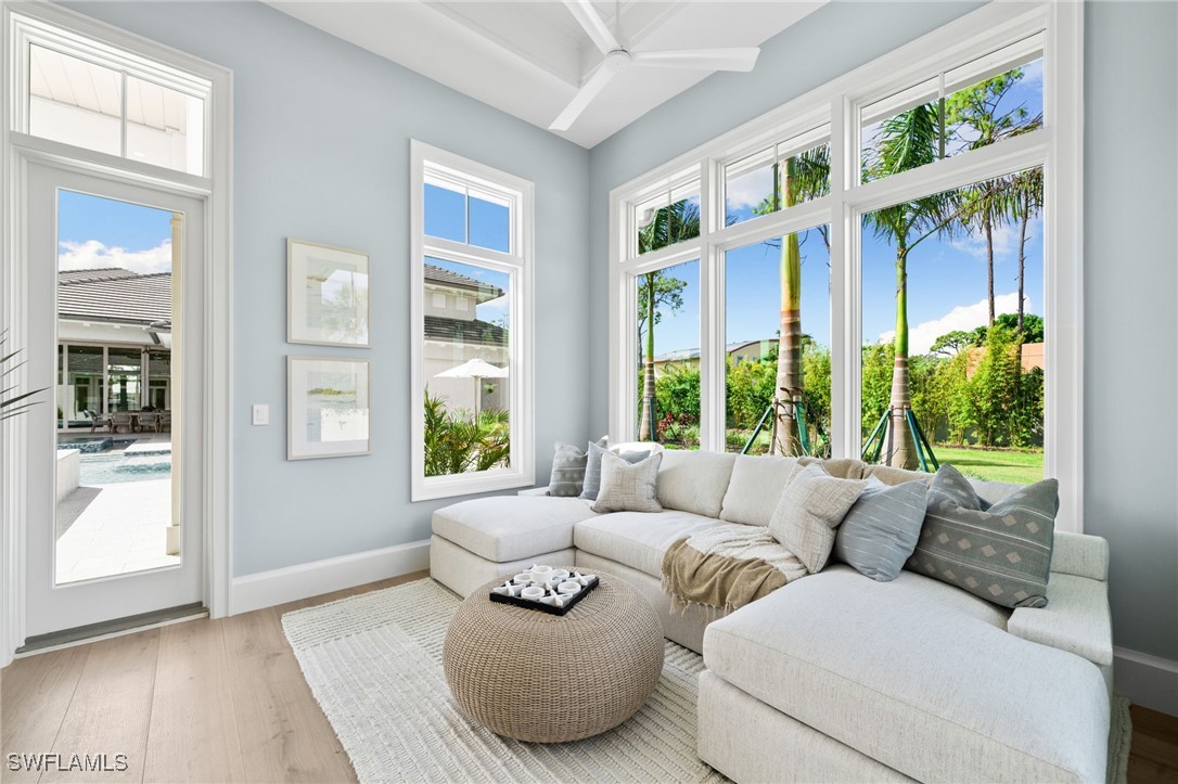 39 Cajeput Drive Naples, FL 34108 - Photo 36 of 50 a living room with furniture and a large window