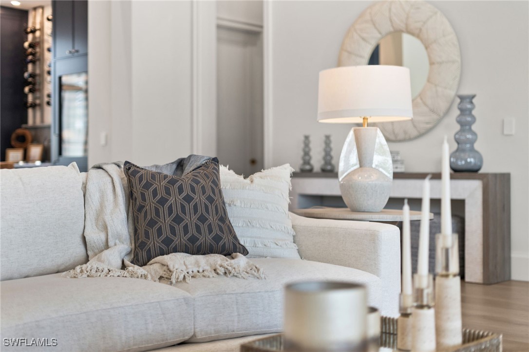 39 Cajeput Drive Naples, FL 34108 - Photo 42 of 50 a living room with furniture and wooden floor