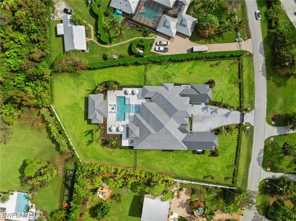 39 Cajeput Drive Naples, FL 34108 - Photo 48 of 50 an aerial view of a house with a garden