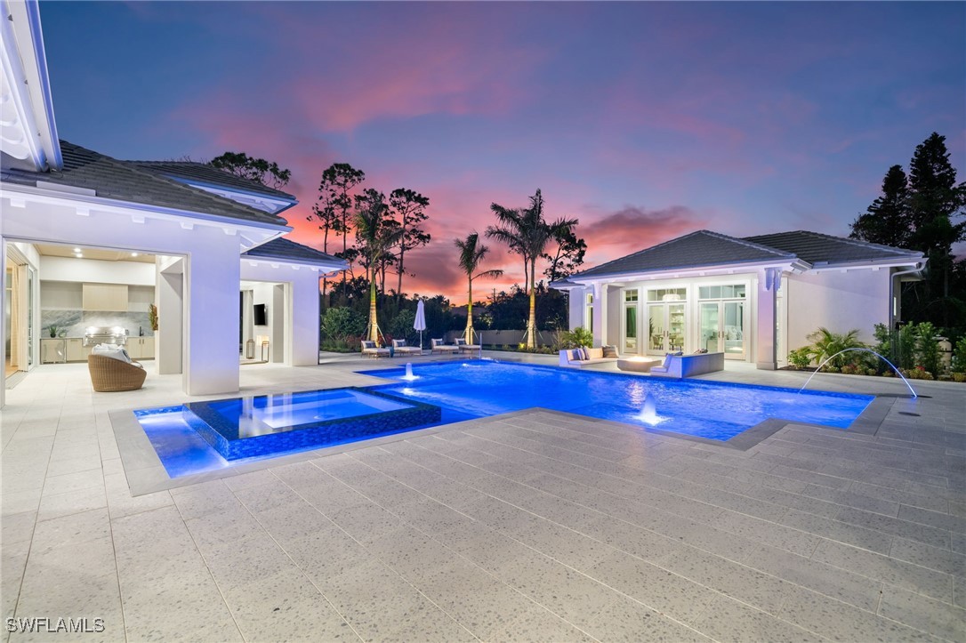 39 Cajeput Drive Naples, FL 34108 - Photo 5 of 50 a view of swimming pool with a patio and a yard