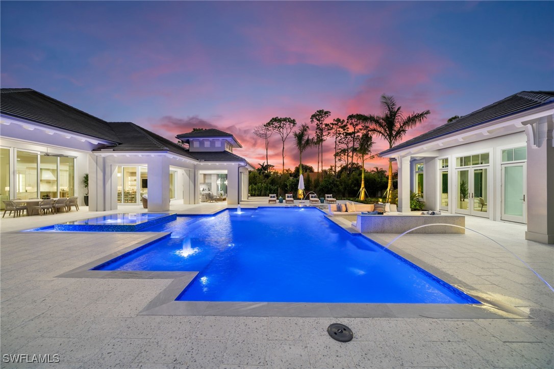 39 Cajeput Drive Naples, FL 34108 - Photo 6 of 50 a view of swimming pool with outdoor seating
