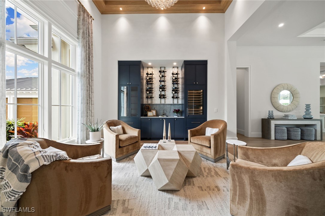 39 Cajeput Drive Naples, FL 34108 - Photo 9 of 50 a living room with furniture and a large window