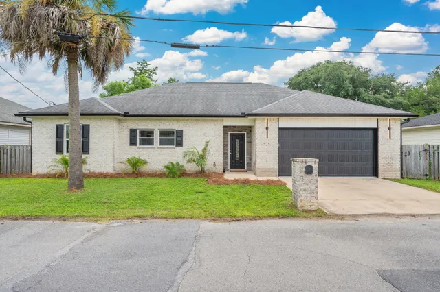 a bathroom with a granite countertop bathtub and shower