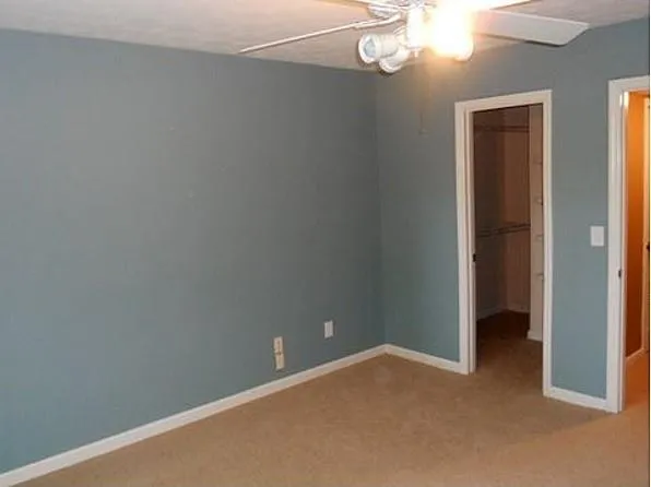 a view of a hall with wooden floor