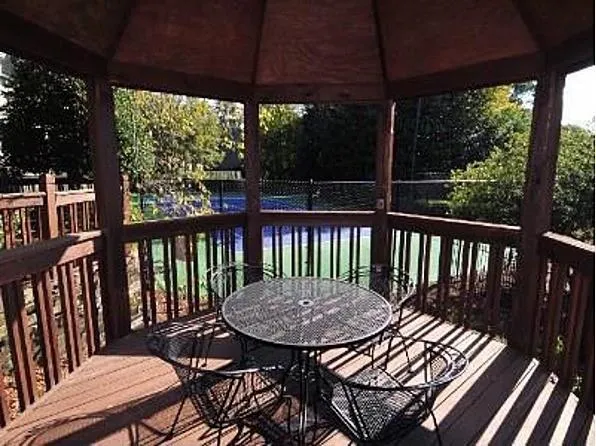 a view of a patio with a table chairs and a table