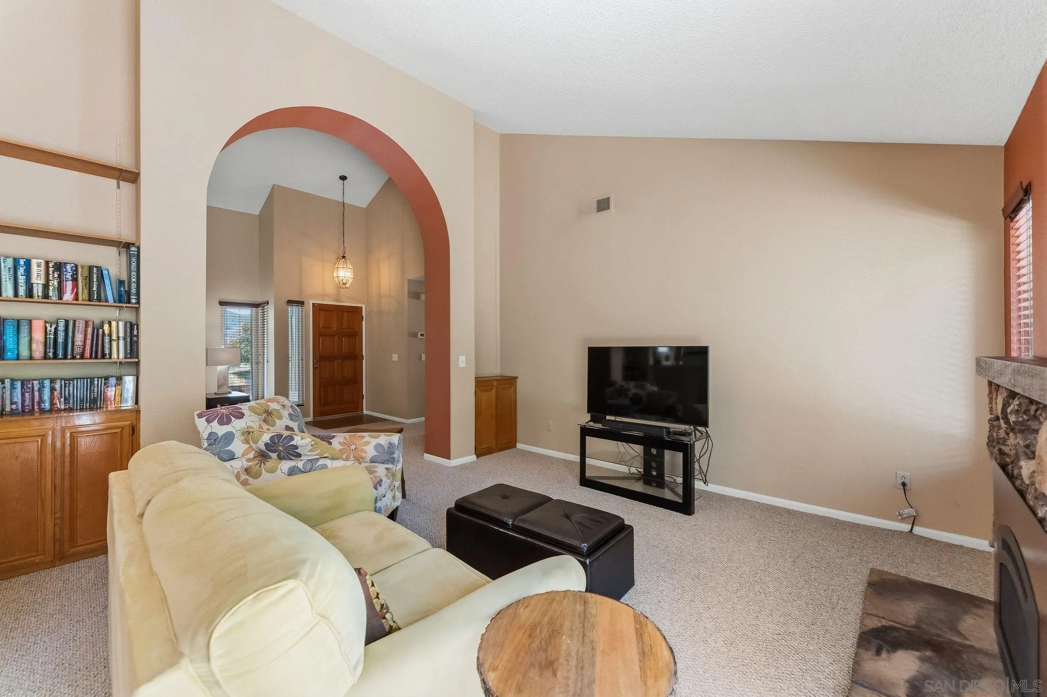 10565 Strathmore Drive Santee, CA 92071 - Photo 12 of 59 a living room with furniture and a flat screen tv